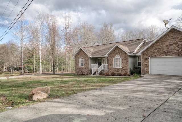 view of front of home featuring a garage and a front yard