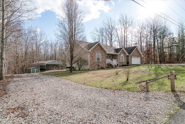 ranch-style house with a front yard, a garage, and a storage shed