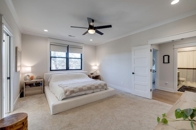 carpeted bedroom with ceiling fan, crown molding, and connected bathroom