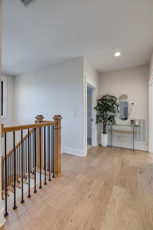 corridor featuring light hardwood / wood-style floors