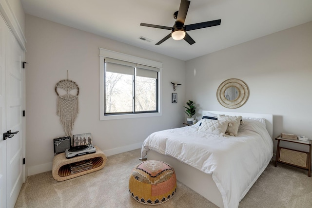 carpeted bedroom featuring ceiling fan