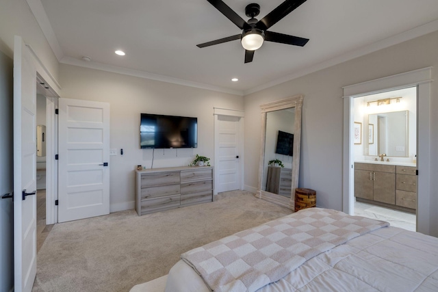 bedroom with ensuite bath, ornamental molding, light colored carpet, ceiling fan, and sink