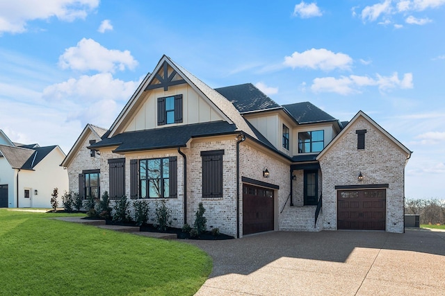 view of front of house featuring a garage and a front yard