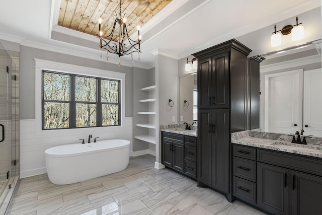 bathroom featuring vanity, ornamental molding, built in features, and plus walk in shower