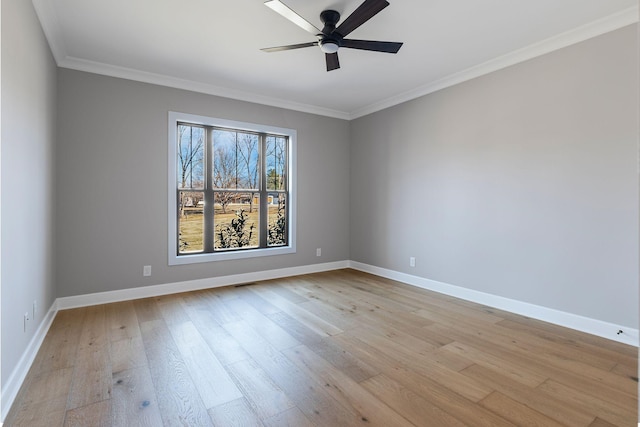 spare room with ornamental molding, ceiling fan, and light wood-type flooring