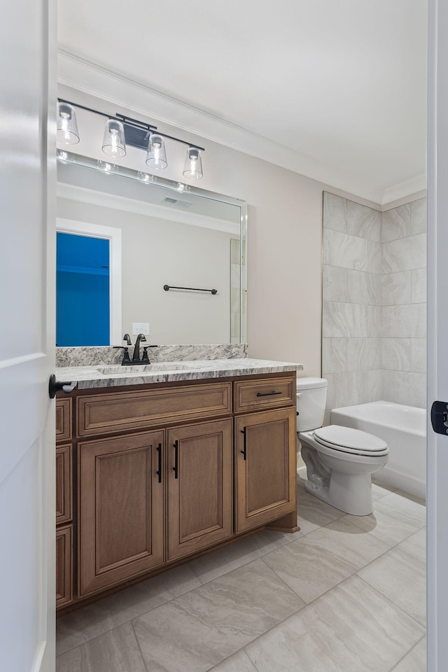 full bathroom featuring vanity, bathtub / shower combination, crown molding, and toilet