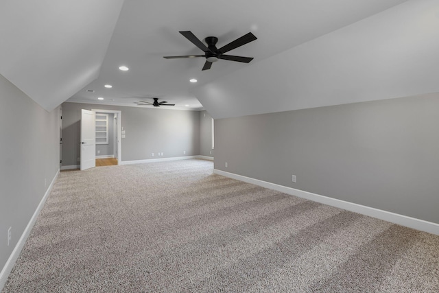 additional living space with ceiling fan, lofted ceiling, and carpet flooring