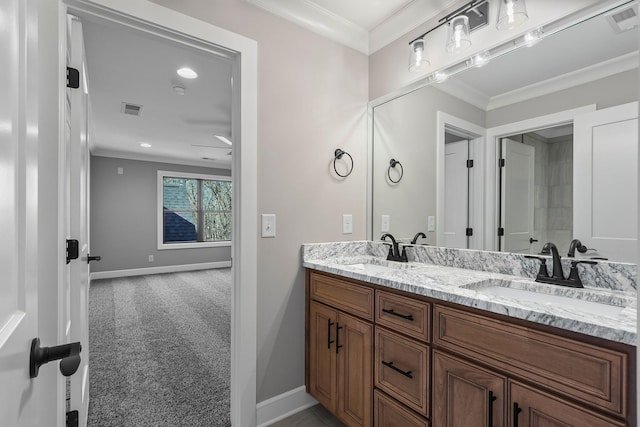 bathroom with vanity and ornamental molding