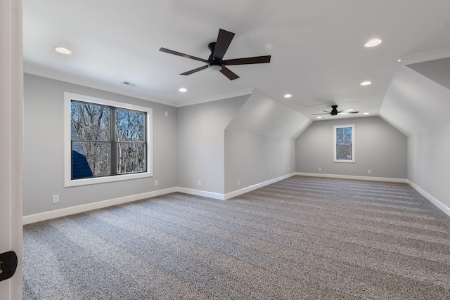 bonus room with ceiling fan, carpet floors, and vaulted ceiling