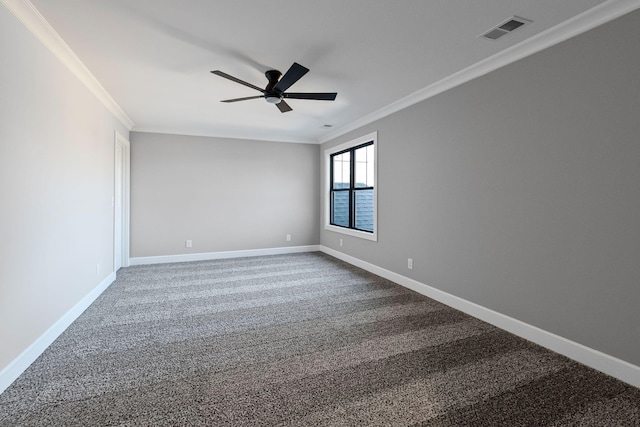 spare room featuring crown molding, ceiling fan, and carpet floors