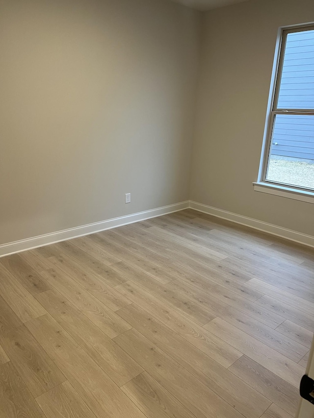 unfurnished room featuring light hardwood / wood-style flooring