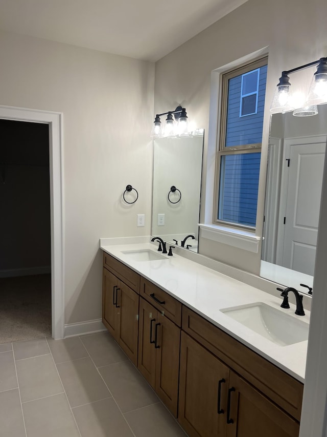 bathroom with tile patterned flooring and vanity