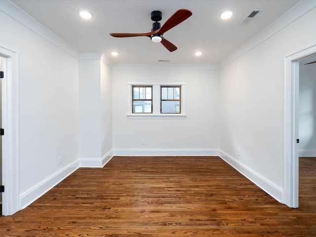 unfurnished room featuring dark hardwood / wood-style flooring, ceiling fan, and ornamental molding