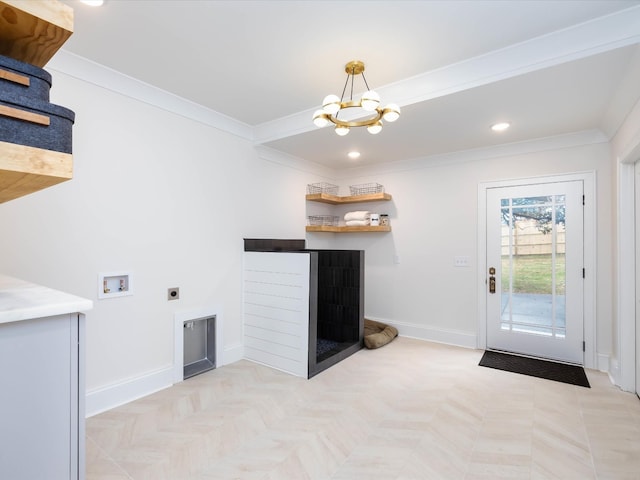 washroom with hookup for an electric dryer, washer hookup, crown molding, a notable chandelier, and light parquet flooring