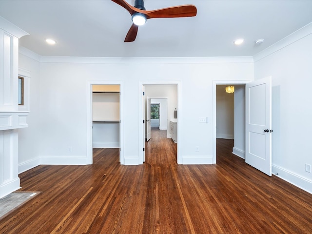 unfurnished living room featuring crown molding, ceiling fan, and dark wood-type flooring