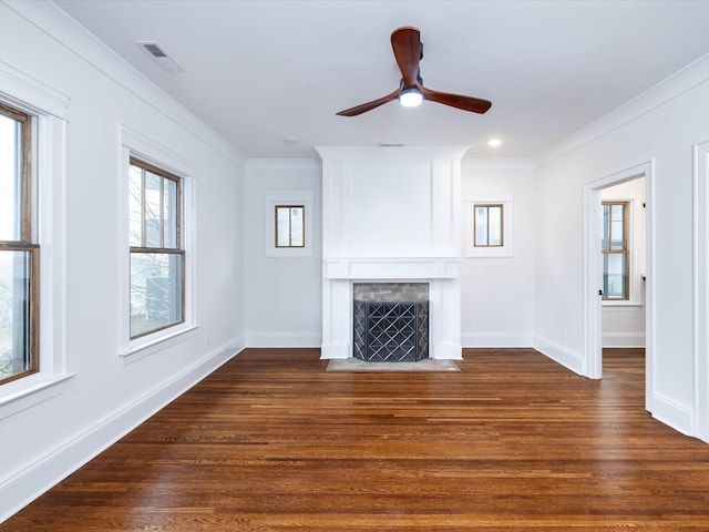 unfurnished living room featuring ceiling fan, dark hardwood / wood-style flooring, and crown molding