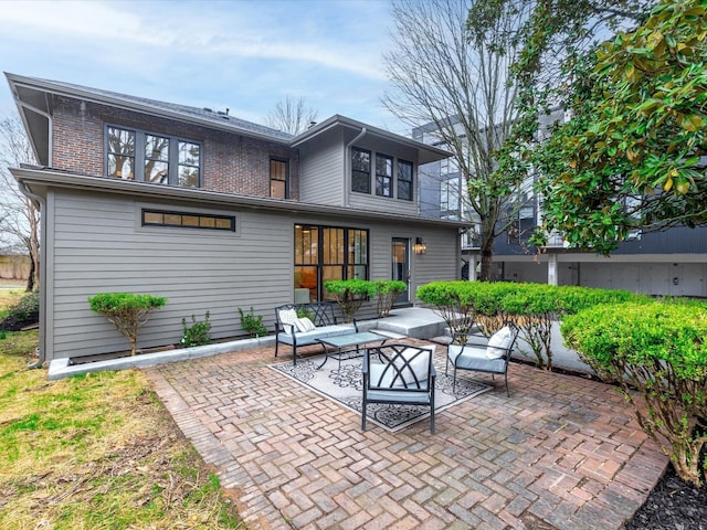 rear view of property featuring a patio area