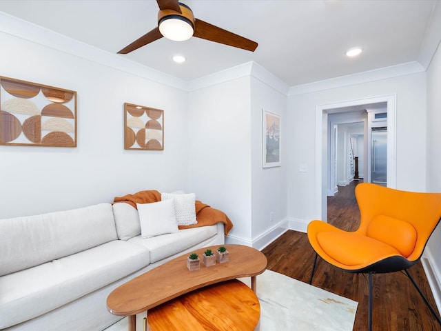 living room featuring hardwood / wood-style flooring, ceiling fan, and ornamental molding