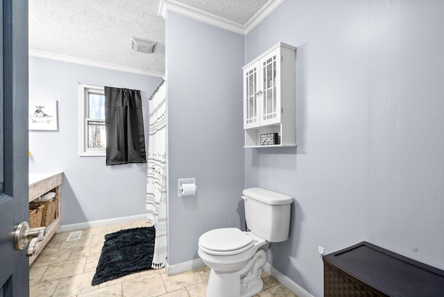 bathroom featuring toilet, a textured ceiling, and ornamental molding