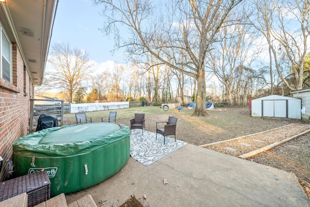 view of patio / terrace with a shed and a swimming pool