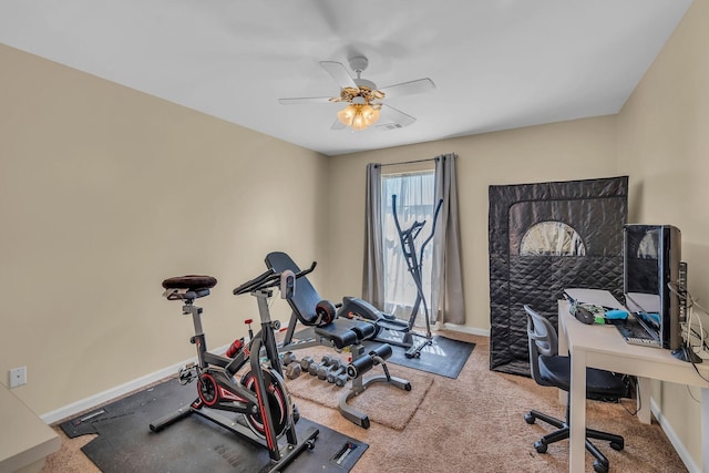 exercise area with ceiling fan and carpet floors