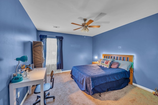 bedroom with ceiling fan and carpet floors