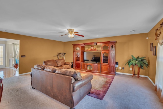 living room with carpet flooring and ceiling fan