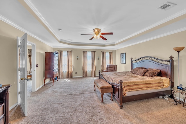 bedroom featuring a tray ceiling, ceiling fan, and crown molding