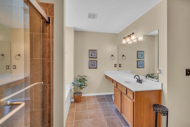 bathroom featuring shower with separate bathtub, vanity, and tile patterned floors