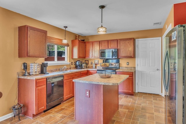 kitchen featuring pendant lighting, a center island, stainless steel appliances, and sink