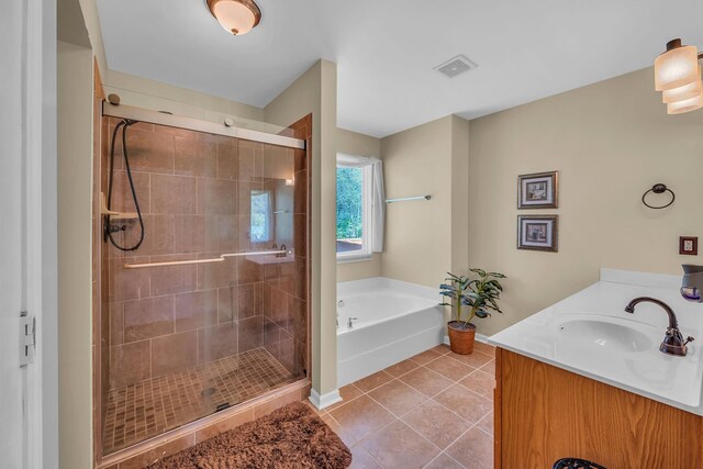 bathroom featuring tile patterned flooring, vanity, and independent shower and bath