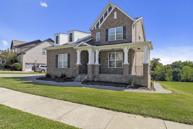 craftsman inspired home with a garage, covered porch, and a front lawn