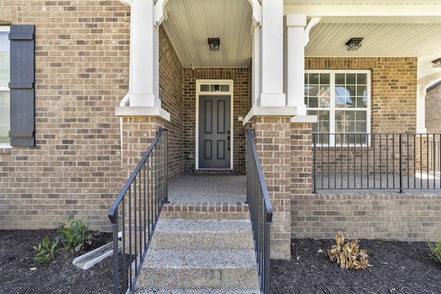 property entrance with covered porch