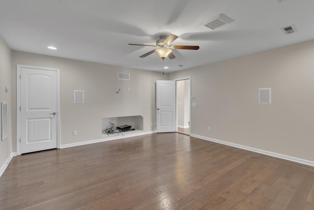 unfurnished living room featuring ceiling fan and hardwood / wood-style floors