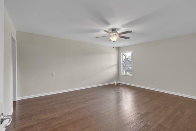 unfurnished room with ceiling fan and dark hardwood / wood-style flooring