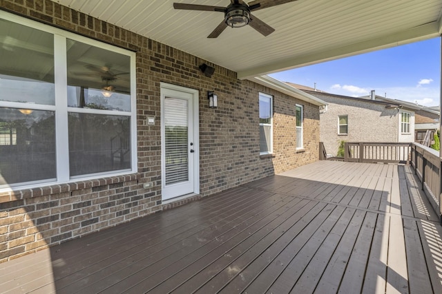 wooden terrace featuring ceiling fan