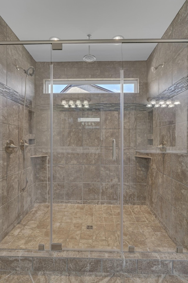 bathroom featuring walk in shower and plenty of natural light