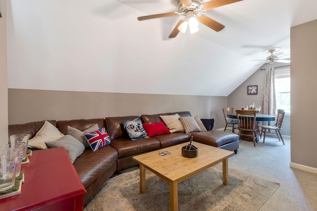 carpeted living room featuring ceiling fan and lofted ceiling