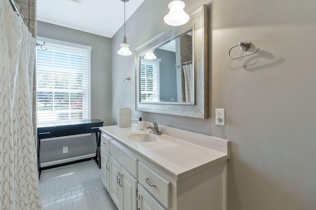 bathroom with tile patterned flooring and vanity