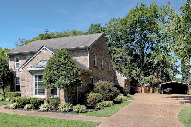 view of side of property featuring a carport