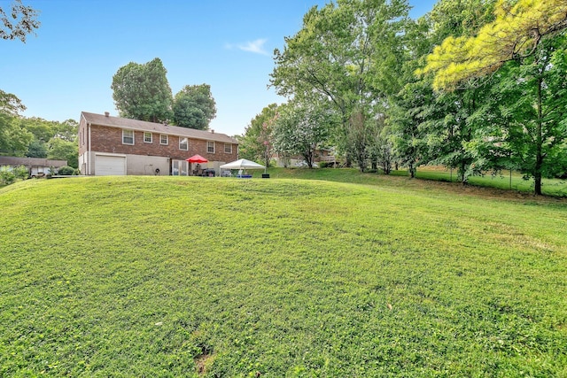 view of yard with a gazebo and a garage