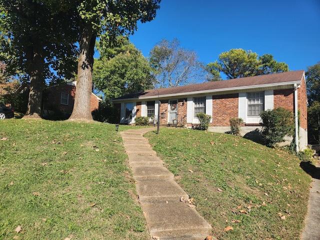 ranch-style home with a front lawn