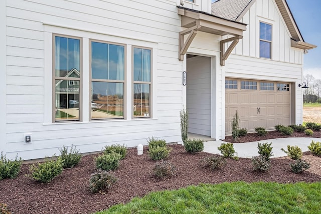 view of side of home featuring a garage