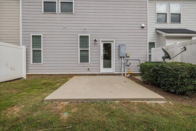 doorway to property with a lawn