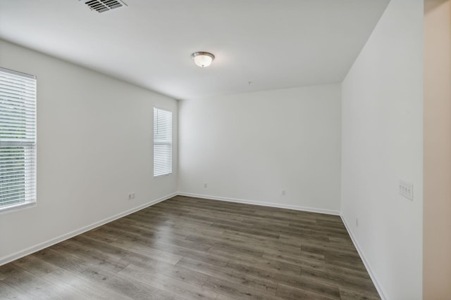 empty room featuring dark wood-type flooring