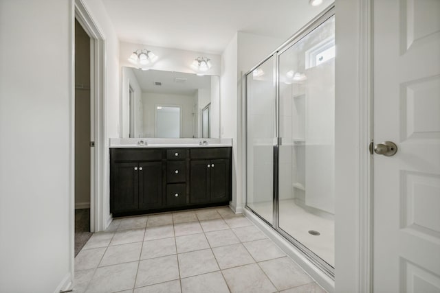 bathroom with vanity, tile patterned floors, and walk in shower