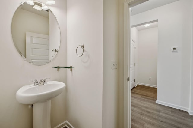 bathroom featuring wood-type flooring