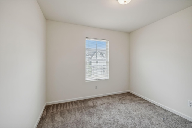 spare room featuring carpet floors