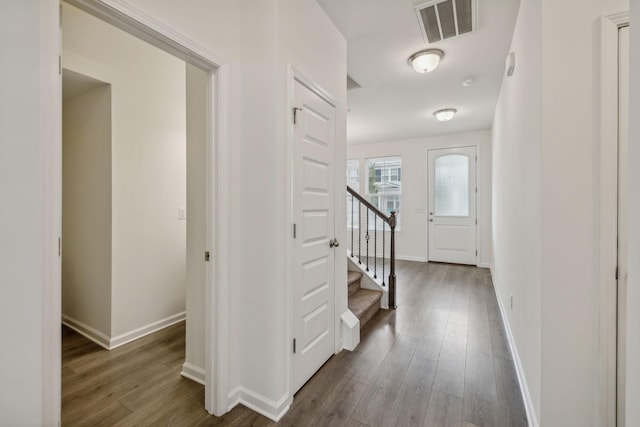 hallway featuring dark hardwood / wood-style flooring