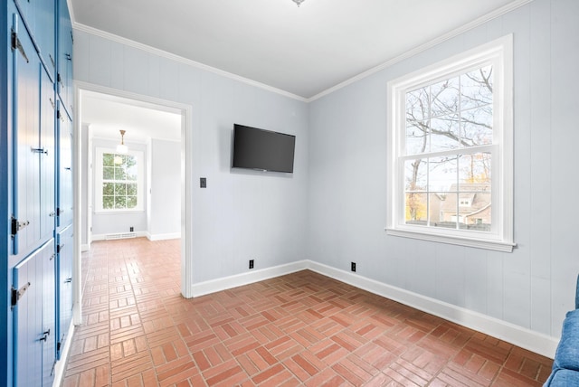 unfurnished room with ornamental molding